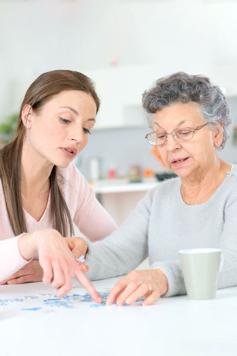 woman talking to an elderly woman