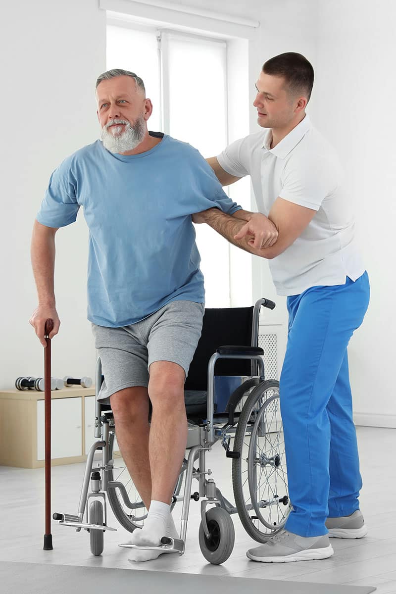 Nurse helping a patient with stroke recovery