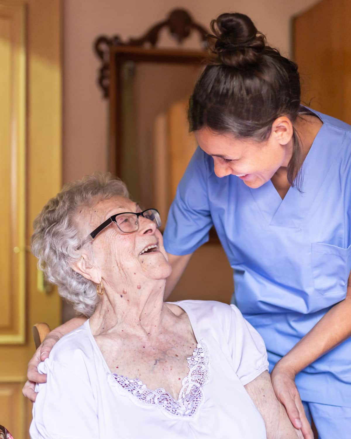 Elderly woman receiving home health care from a nurse