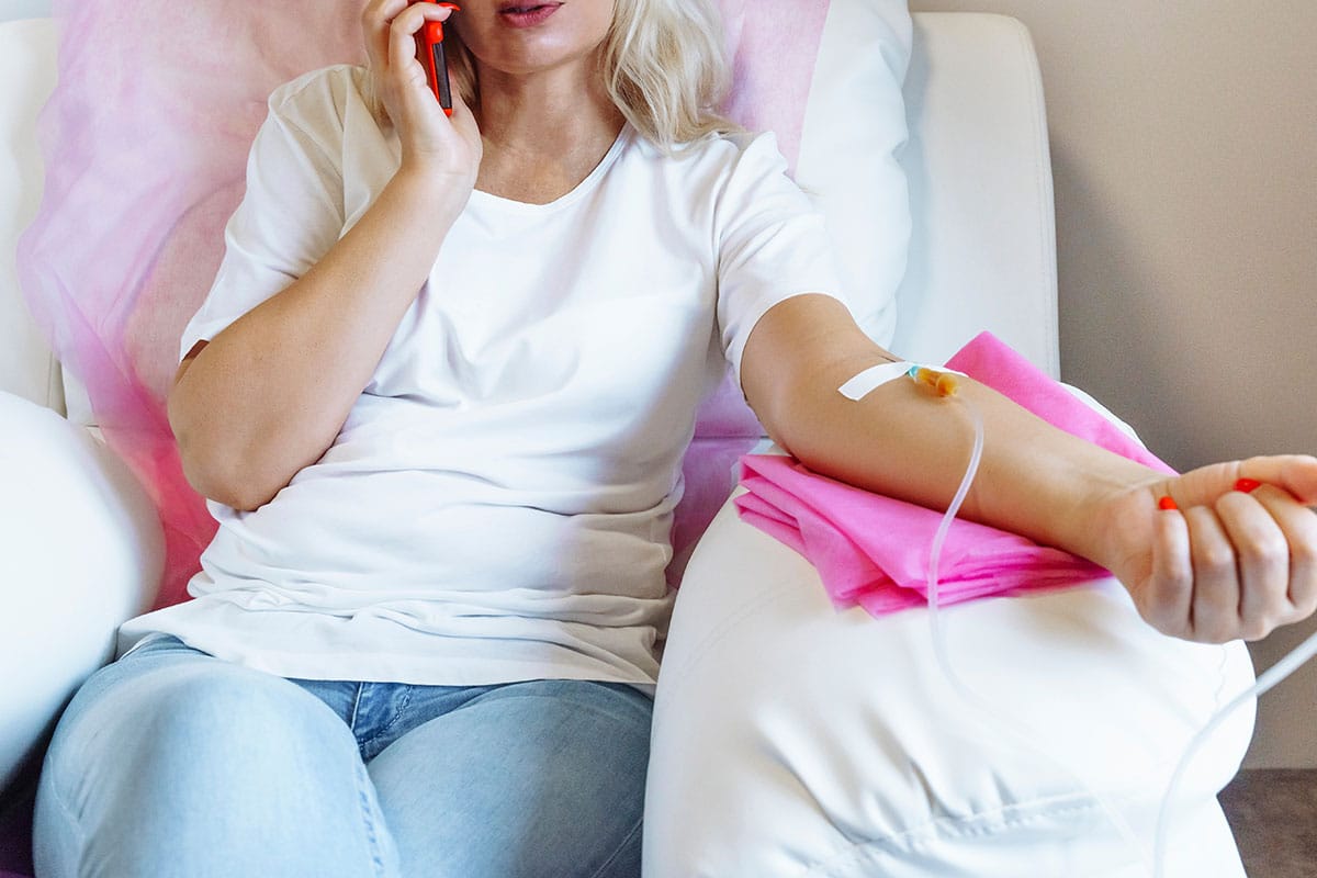 Woman getting infusion therapy