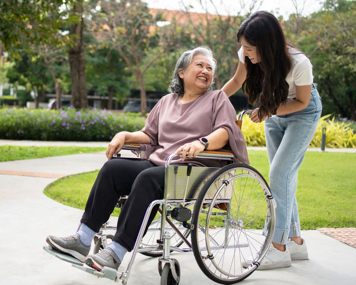 Patient in wheelchair with caregiver