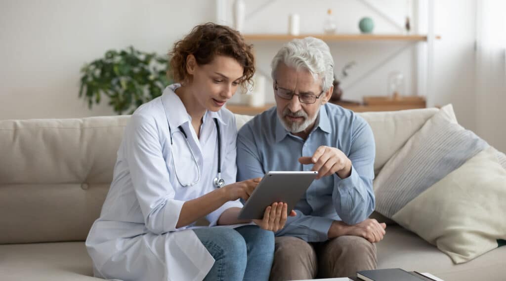 doctor talking with an old man