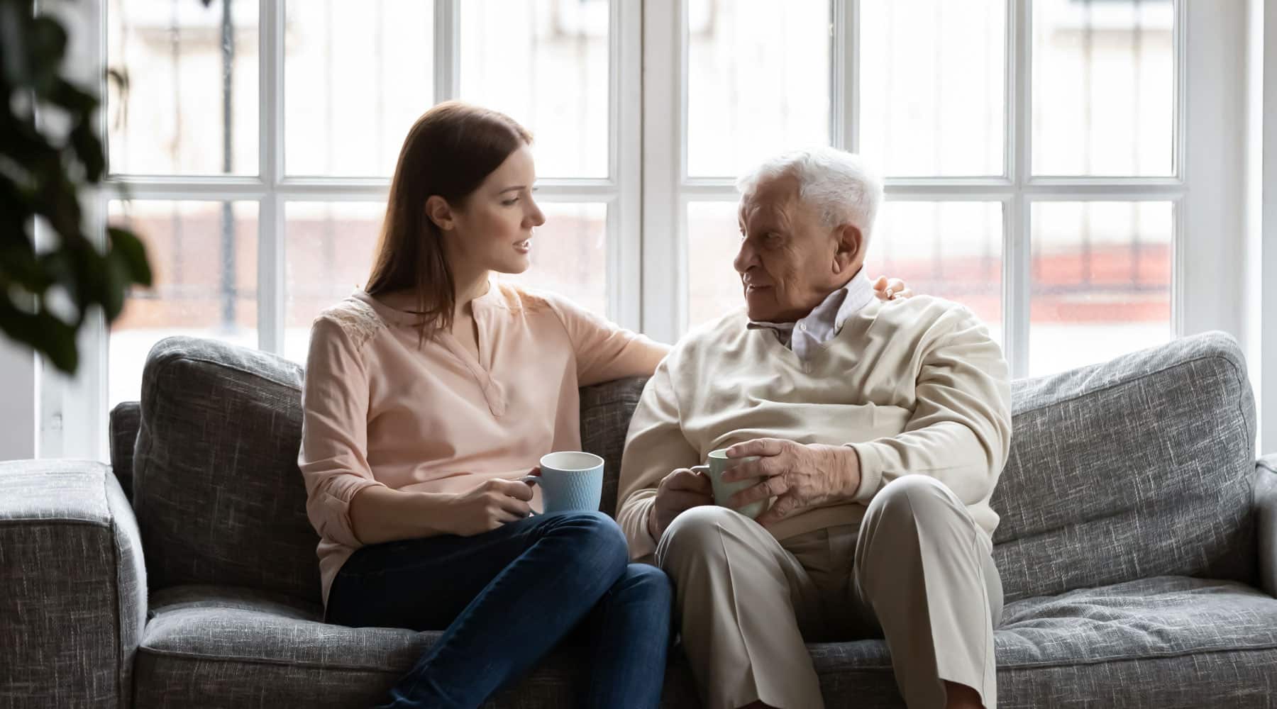 elderly man talking with his daughter