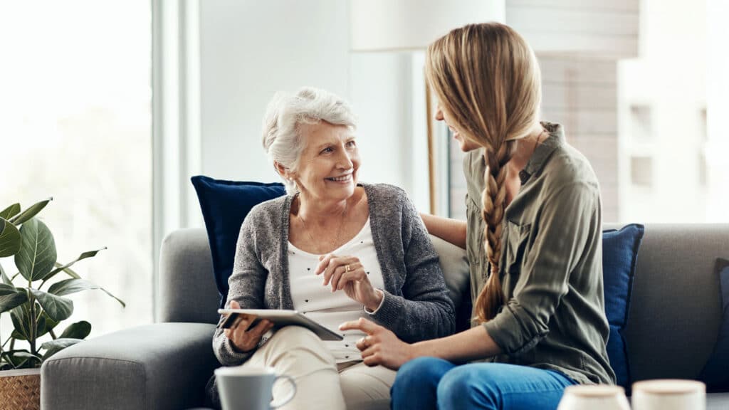 woman talking to another elderly woman