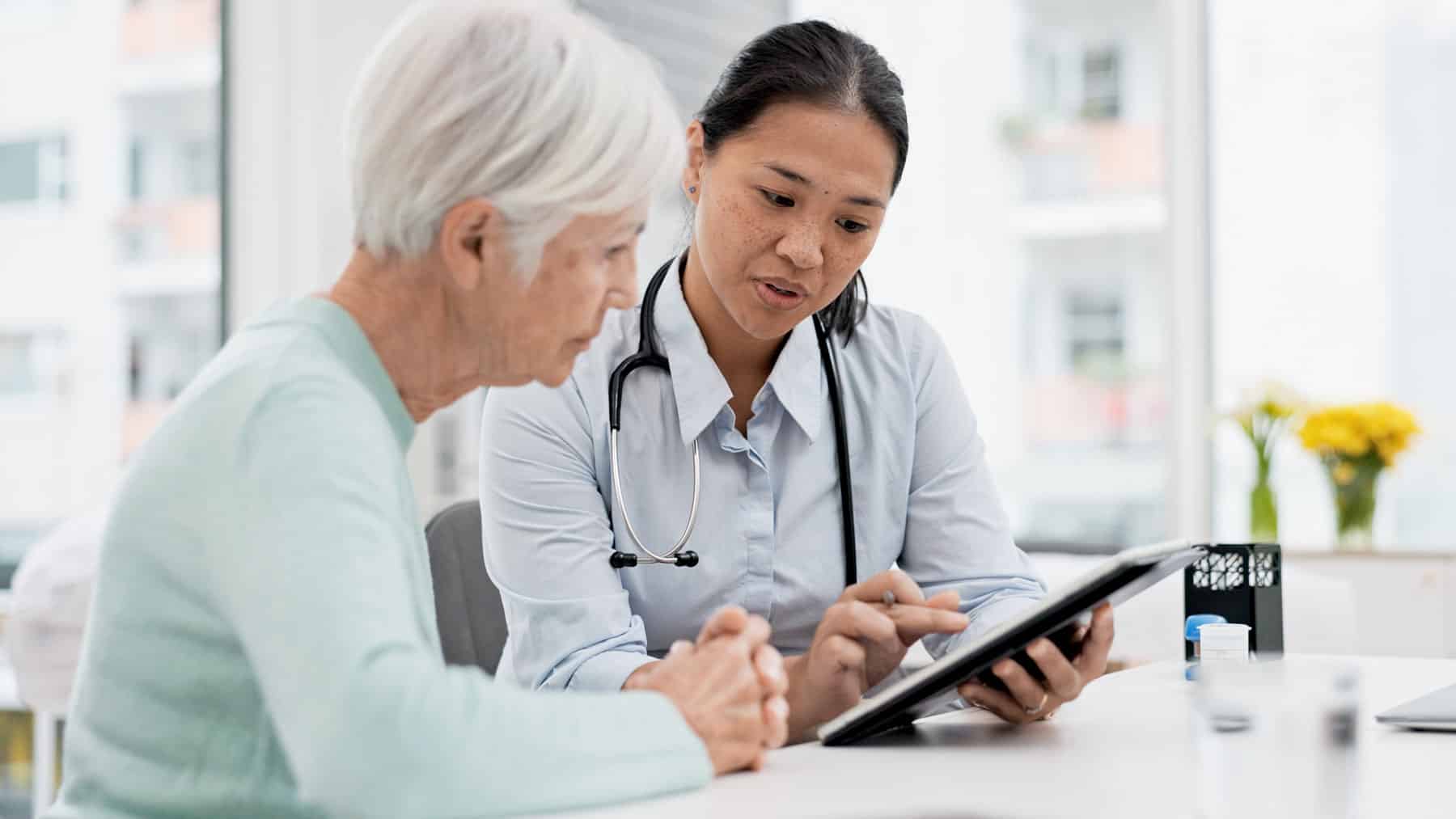 Doctor talking to an elderly patient